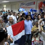 Participantes de la XX Brigada Latinoamericana y Caribeña de Solidaridad con Cuba, durante un encuentro de los familiares de los Cinco Héroes, en el campamento internacional Julio Antonio Mella, en Caimito, provincia de Artemisa