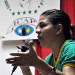 Intervención de Kenia Serrano, presidenta del Instituto Cubano de Amistad con los Pueblos (ICAP), durante un encuentro de los familiares de los Cinco Héroes, con la XX Brigada Latinoamericana y Caribeña de Solidaridad con Cuba, en el campamento internacional Julio Antonio Mella, en Caimito, provincia de Artemisa
